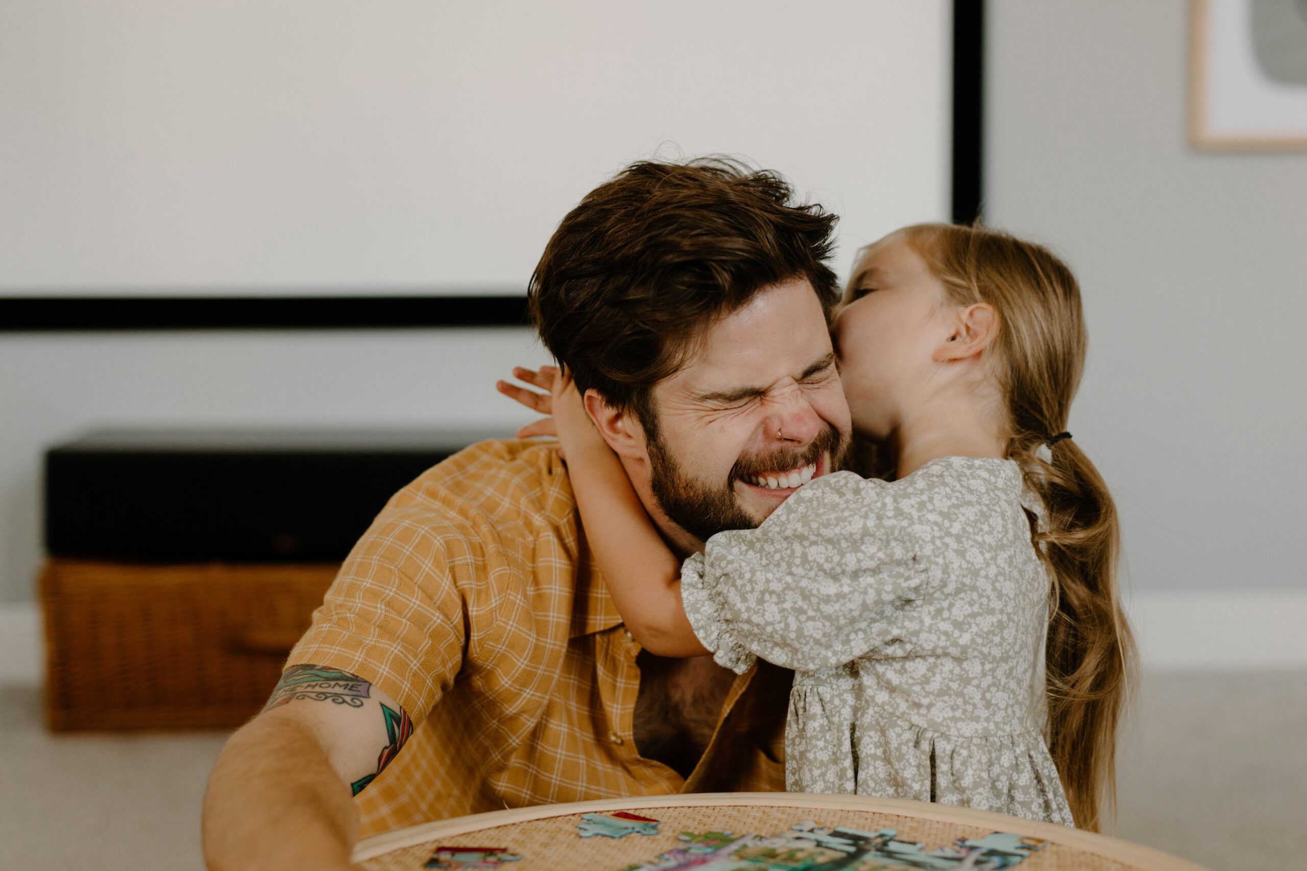 Father and daughter relaxing in a bright, healthy home